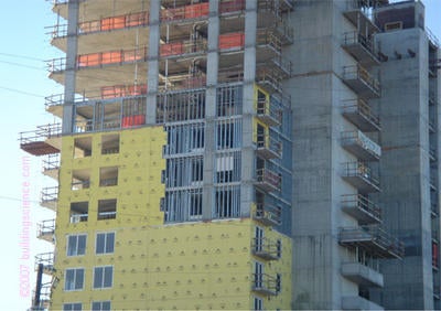Photo_06: Non-paper faced exterior gypsum sheathing over uninsulated steel cavity